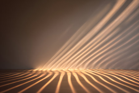 Natural light streams through a window, casting soft, striped shadows on a wooden floor in a simple, uncluttered room during golden hour. The warm tones create a serene atmosphere.の素材