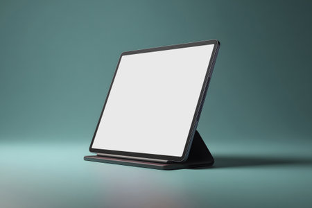 A sleek digital display stand is set on a flat surface, showcasing a blank screen. This setup is ideal for presentations or promotional displays in indoor environments.の素材