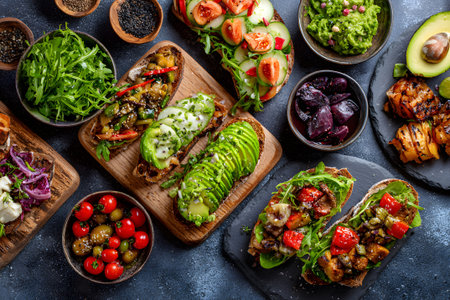 Colorful and healthy plant-based meal spread with fresh ingredients at a dining tableの素材