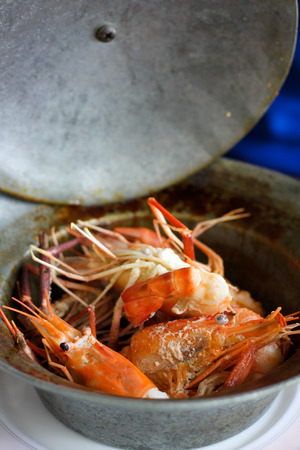 Bake shrimp with salt in clay potの写真素材