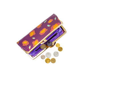 Coins and an open purse on a white background.の写真素材