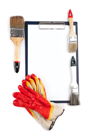 Set of paint, rubber gloves and a folder with a clip.の写真素材
