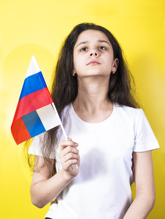Happy little girl with Russian flagの写真素材