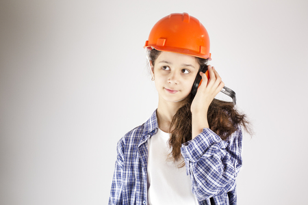 Beautiful girl in a helmet. Woman using headphonesの写真素材