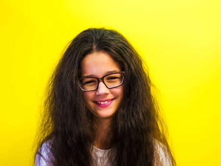 Portrait of pretty smiling woman happily looking in camera isolated