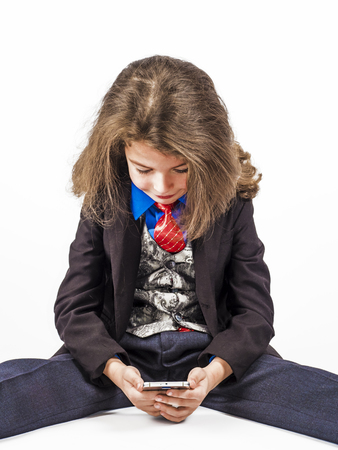 Concept. A small businessman uses a smartphone.の写真素材