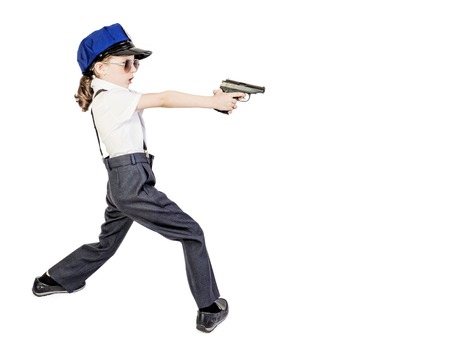 Little long-haired boy, like a policeman, isolated on whiteの写真素材