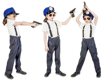 Little long-haired boy as a policeman, isolated on whiteの写真素材