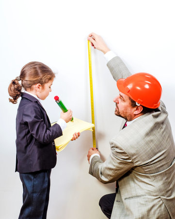 A young student and a construction engineer are on training.の写真素材