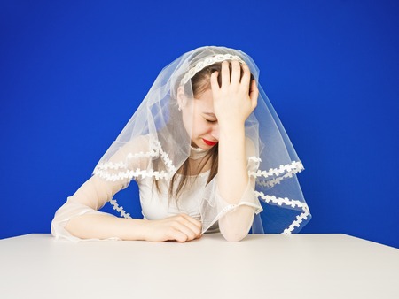 Abandoned bride. enchanting brunette cancels weddings because of quarrels with the groomの写真素材