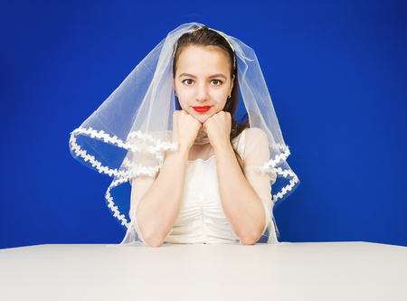 Beauty woman with wedding hairstyle and makeup. Bride fashion. Woman in white dress. Girl with stylish haircut.の写真素材