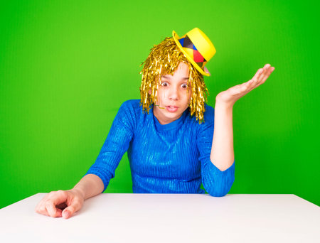 Portrait of a young woman in a comic pop art style sitting at a table. Shocked female in yellow and...
