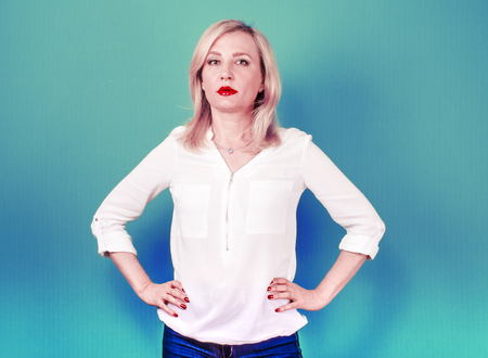 Studio shot of attractive female. Blue background.の写真素材