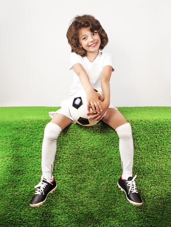 Boy with soccer ball on the green grass.の写真素材