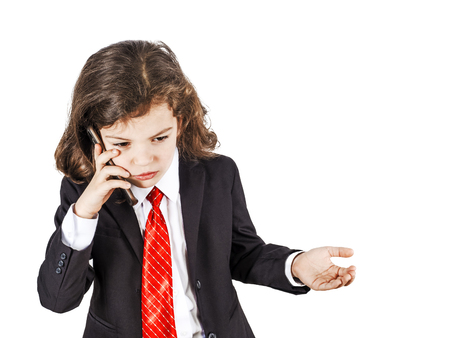 Business Concept: Portrait of young handsome businessman talking on mobile phone with serious and stress expression. Isolated over white background.の写真素材