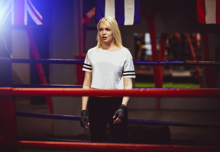 Sexy sport blonde girl boxer posed in the ring. Fit woman boxingの写真素材