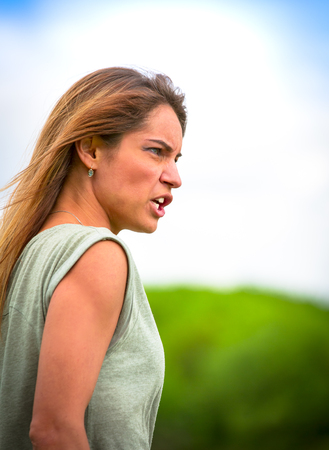 Portrait of beautiful girl in profile close-up in the wind. Copy spaceの写真素材