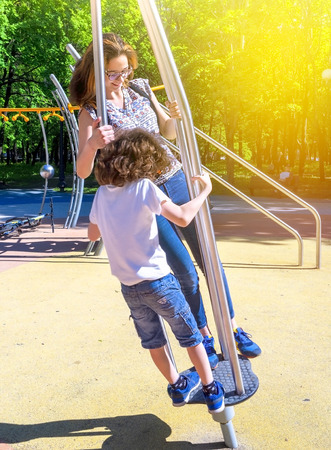 happy children at playground area in summerの写真素材