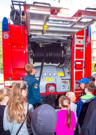 MOSCOW, RUSSIA - AUGUST 07, 2019: Fire station. A fireman explaining his job to children