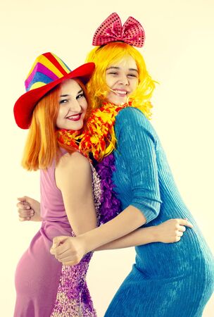Attractive playful young women ready for carnival parties. Lifestyle and the concept of friendship: a group of two girl friends.の写真素材