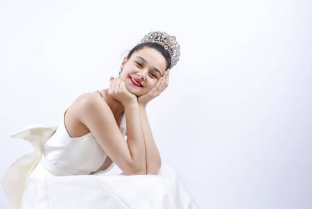 happy bride smiling at camera. Wedding Dress. Wedding decorations. Copy spaceの写真素材