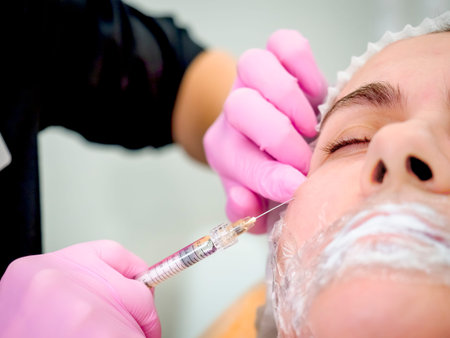 contour plastic. A cosmetologist injects a botulinum toxin to tighten and smooth out wrinkles on the...