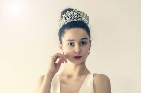 Beautiful bride.Close-up portrait of attractive fashion model teenager bride cocky looking at the camera. Studio shot. Isolated. Copy spaceの写真素材