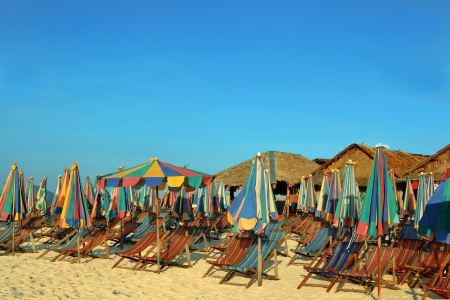 Vacation chairs and umbrellas on sandy tropical beach of Thailand islandの写真素材