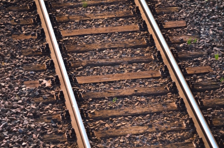 Railway tracks with wood backgroundの写真素材