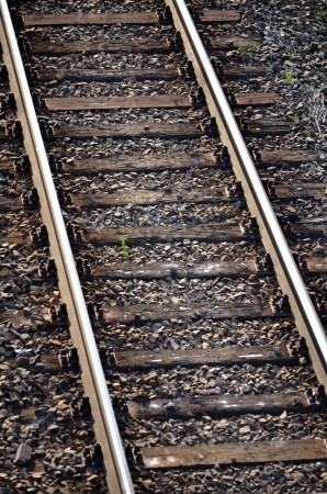 Railway tracks with wood backgroundの写真素材