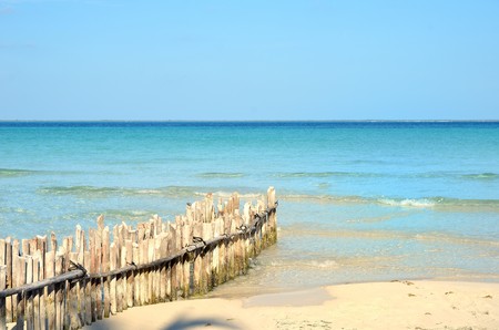 sea and beach with windbreakの写真素材