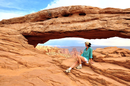 Women in Mesa Arch Canyonlands National Parkの写真素材
