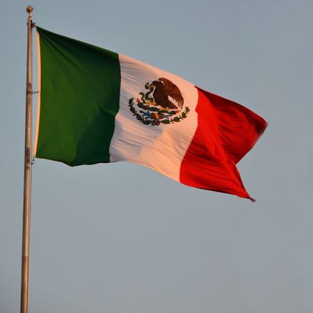 zoom of mexican flag in sunset on Yukatanの写真素材