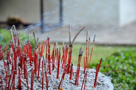 Red joss sticks burn in templeの写真素材