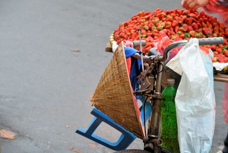 Old bicycle with hat and strawberryの写真素材