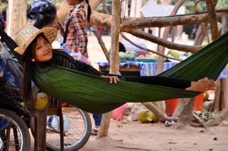 Young woman in hat lying in a hammock in Cambodia Angkor Watのeditorial素材