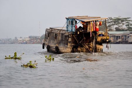 boats in the valley of the Mekong river in Vietnamの写真素材