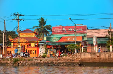 CAN THO,VIETNAM - MARCH 5 2015 - View of street near of Mekong river full of billboards.のeditorial素材