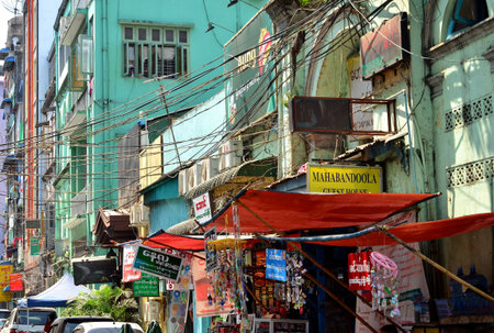 Yangon, Myanmar - March 9, 2015: A street archtecture view with colonial building in the town of...