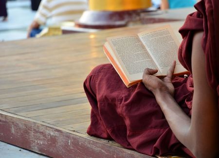 Yangon, Myanmar - November 30: Shwedagon Pagoda March 9 2015 in Yangon. Monks reading book.のeditorial素材