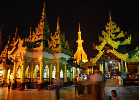 Prayers on temple area in Shewedagon Myanmarのeditorial素材