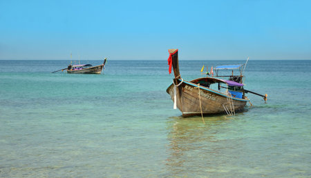 KRABI, THAILAND - MARCH 18, 2015: Long boats in andaman sea in summer vacation