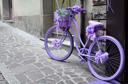 old violet bicycle on streetの写真素材