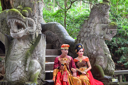 BALI, INDONESIA - MAY 17. Couple on Monkey Bridge Ubada Bali after wedding ceremony on May 17, 2016...