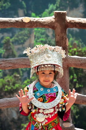 Zhangjiajie, China - May 12, 2017: Little girl in traditional chinese clothes in Wulingyuan Zhangjiajie National Park, Chinaのeditorial素材