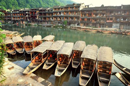 Boats around riverside at the Bridge in Fenghuangの写真素材