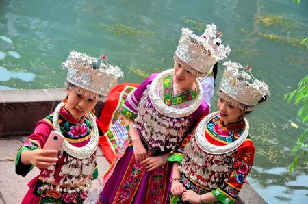 Fenghuang, China - May 15, 2017: Woman wearing traditional chinese clothes in the ancient town of Fenghuang.のeditorial素材