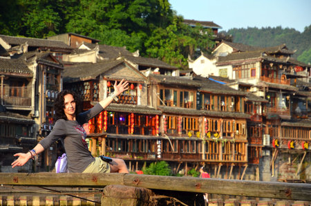 Women at riverside on the Phoenix Hong Bridge in Fenghuangのeditorial素材