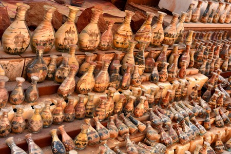Souvenirs in Jordan, bottles with sand and shapes of desert and camelsの写真素材
