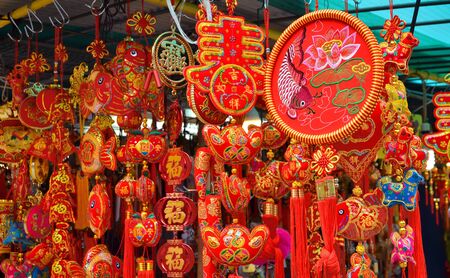 Hong Kong-February 5, 2019: People are seen choosing the Chinese New Year decorations at the stalls outside Wong Tai Sin Temple on the first day of Chinese New Year.のeditorial素材